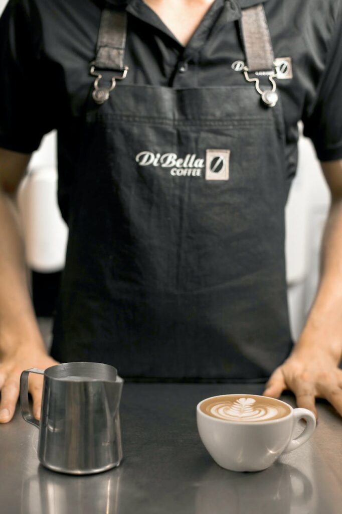 man prepared cup of cappuccino